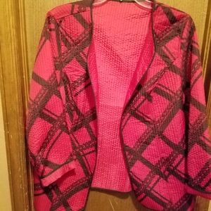 Reversible hip-length quilted jacket.